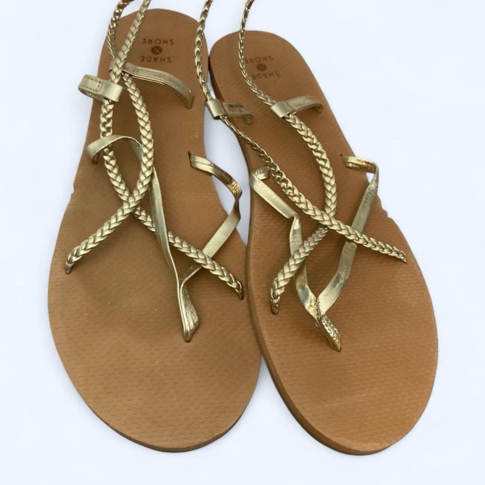 Gold faux leather sandals with adjustable straps and braided details 11